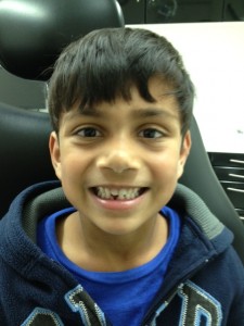 Ketan's son Kyle after losing his first tooth